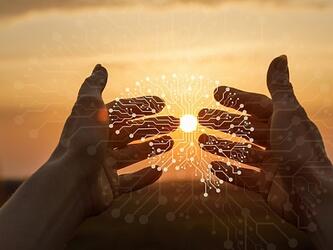 Hands holding data points in shape of a brain